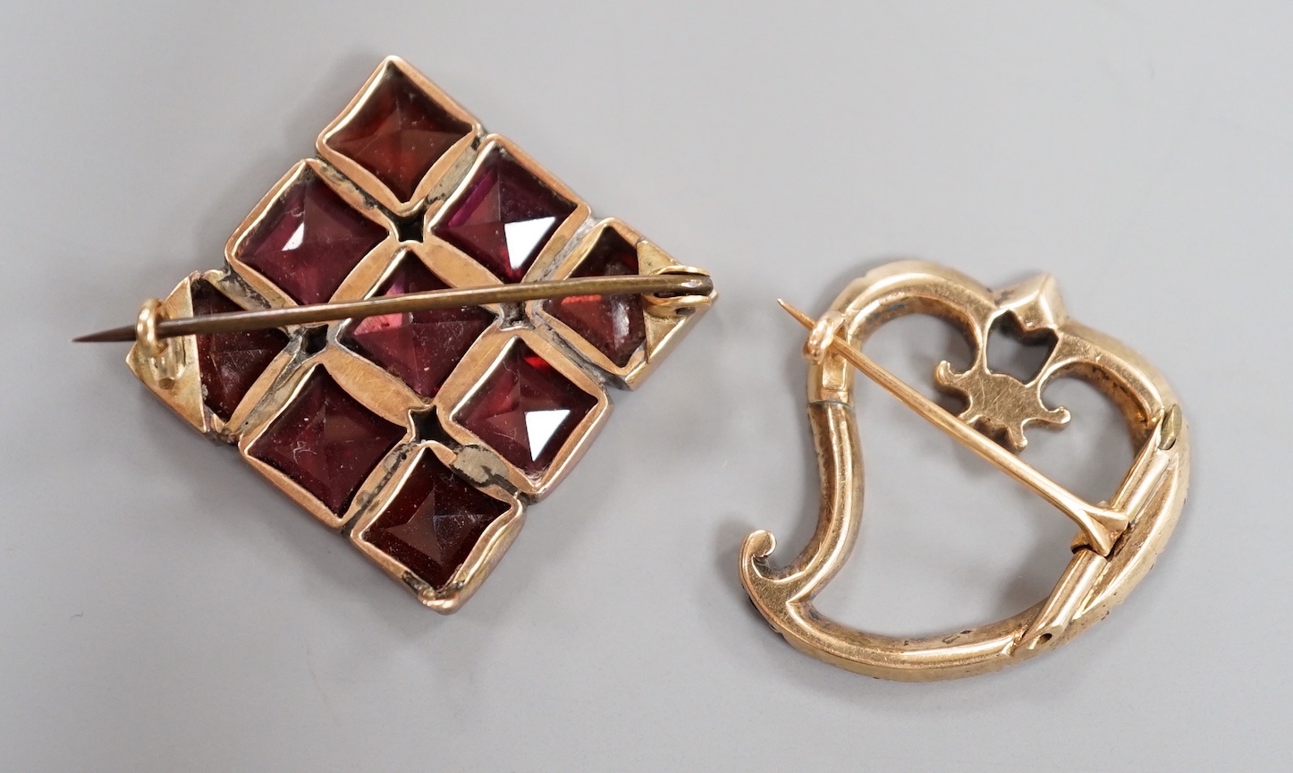 Two Victorian yellow metal and garnet set brooches, square and stylised heart shape, largest 32mm.